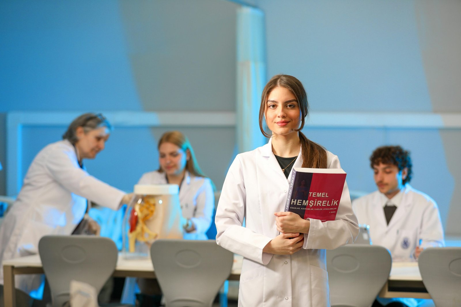 Home Young nursing students engaging in lab study, showcasing medical education.