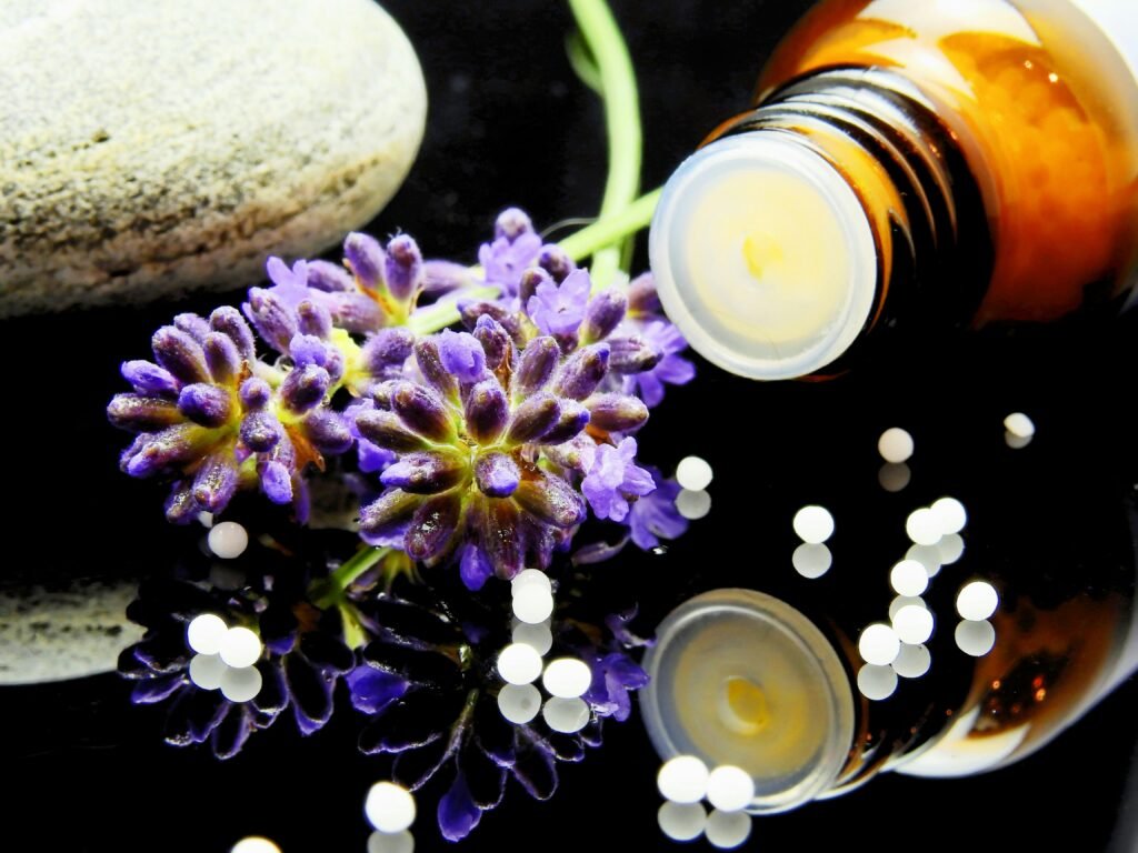 Master Courses Lavender flowers with herbal homeopathy on a reflective surface, ideal for natural therapy themes.