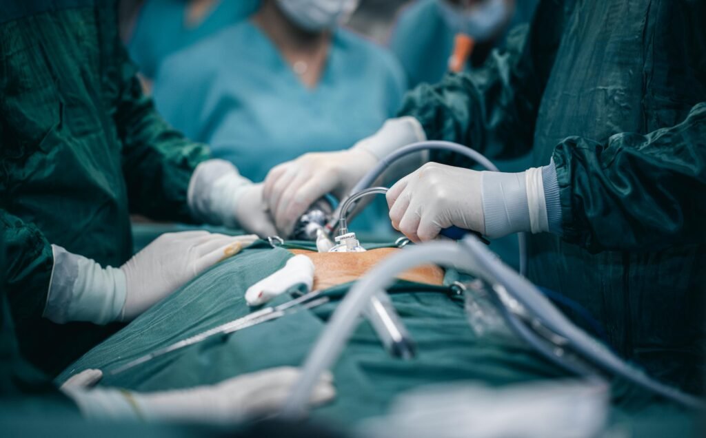 Diploma Courses A detailed view of surgeons in action during an operation, highlighting surgical precision.